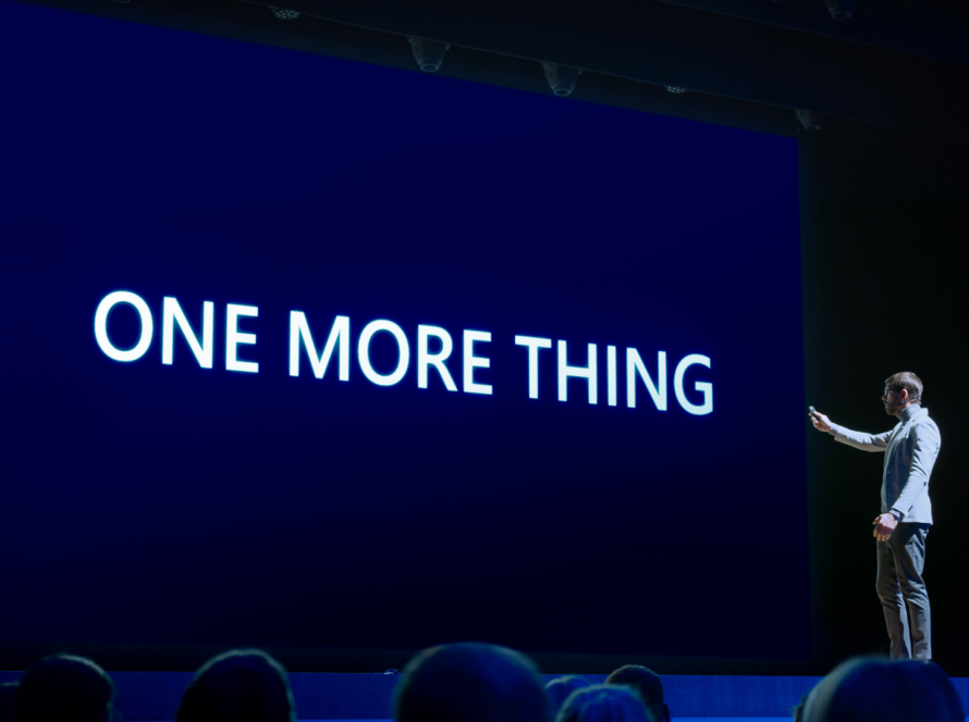 man on stage speaking